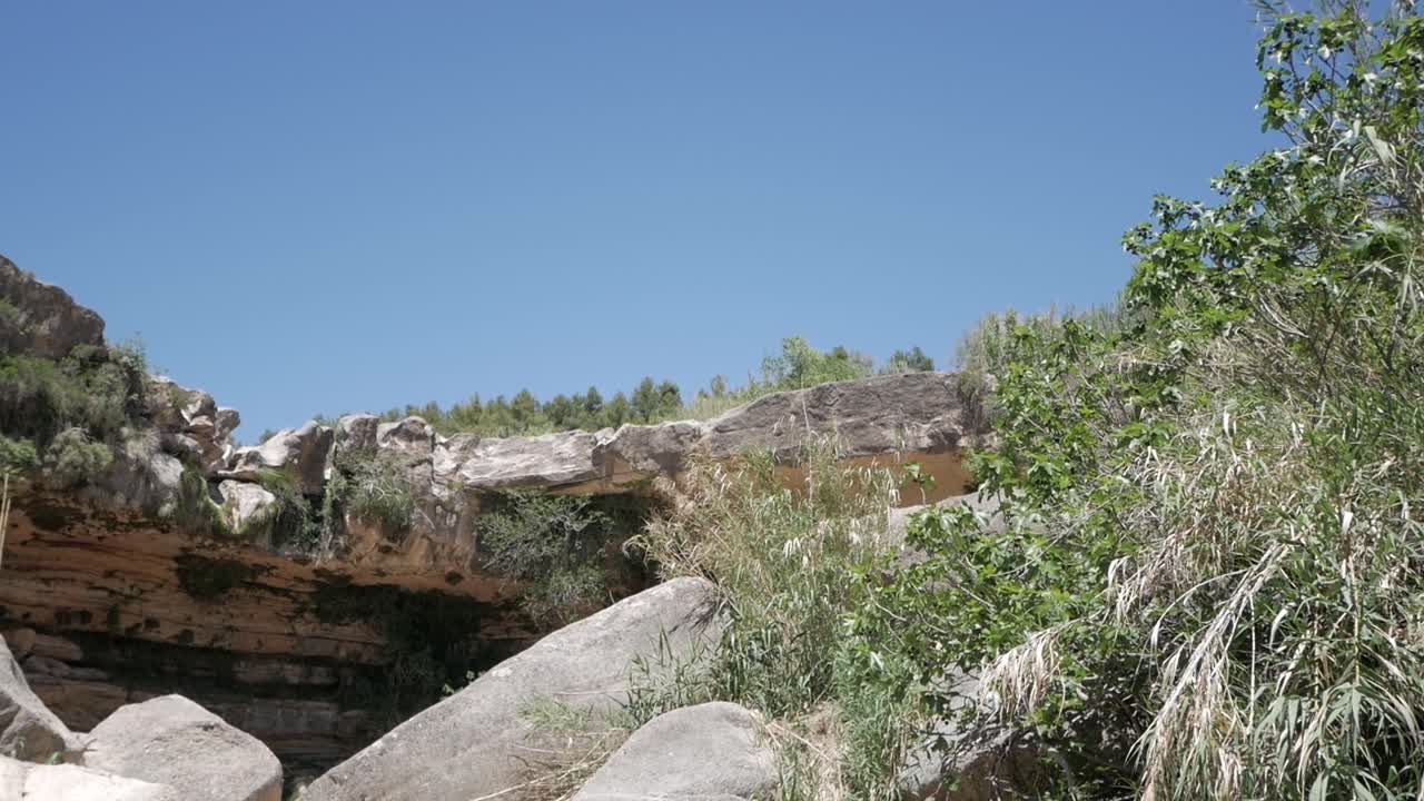 Rocky cave and blue sky at Salt de la Portellada in Matarraña, Aragon, Spain