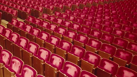 rows of old empty cinema seats in spacious vintage venue waiting for performance