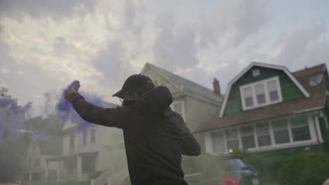 excited man running with blue smoke stick in slow motion