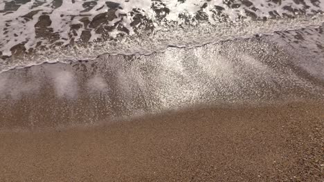 sea waves splashing on the beach