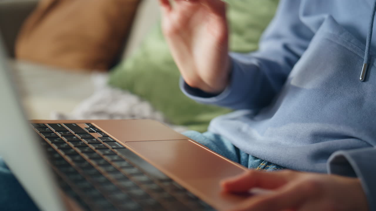 Close-up of a person using a laptop