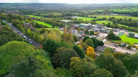 aerial footage heads toward a massive uk chemical facility, revealing pipelines, metal structures, cooling towers, and chemical storage