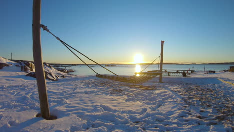 4k shot of a hammock by a beach on a winter day in gothenburg, sweden