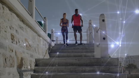 walking down stairs, two people with digital network animation overlay in school