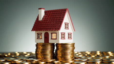 house on a stack of coins - real estate investment