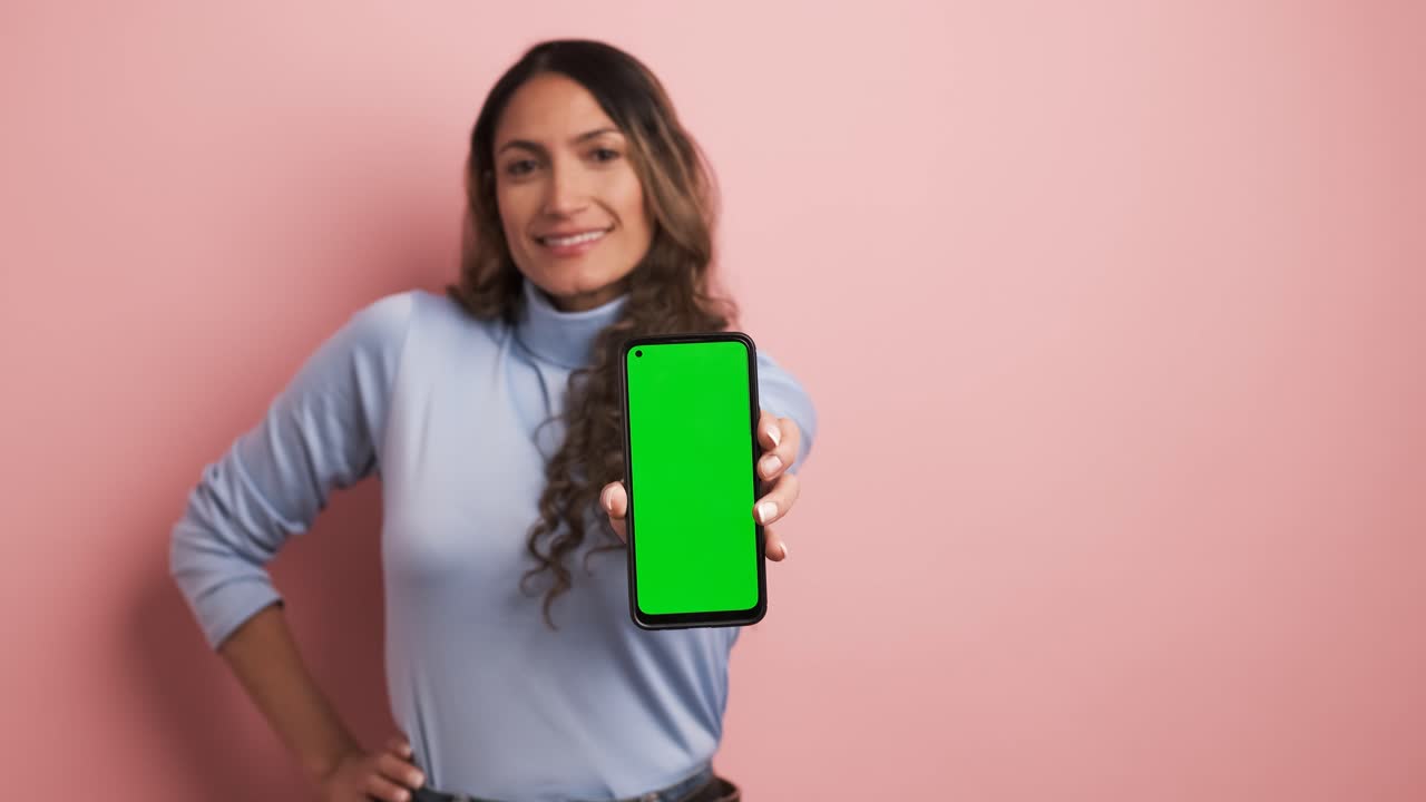 Focus on screen of a mobile held by a woman