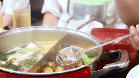 preparing hotpot with pork liver and vegetables