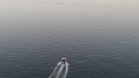 Speedboat-Traveling-Across-Calm-Sea-Leaving-Marks-On-Water-Surface