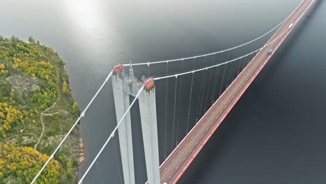 bridge hogakustenbron with concrete pylon over calm blue sea in sweden