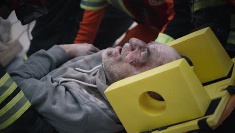 Injured Man Being Treated by Emergency Medical Services