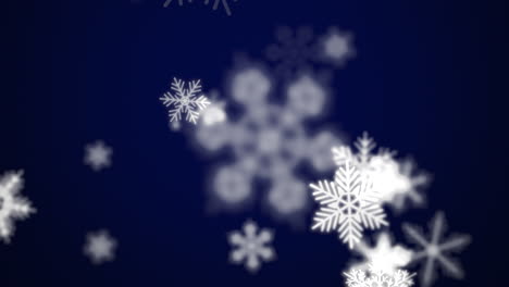 Snowflakes-floating-in-the-air-on-a-blue-background