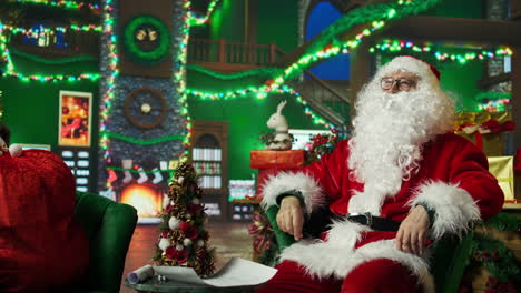 santa claus sitting in a christmas setting