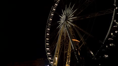 illuminated budapest eye in the evening - tilted up wide shot