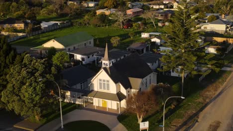 sunlit church of st john's union during sunset in opotiki, new zealand