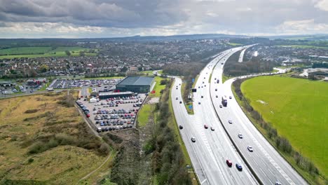 aerial drone cinematic video footage of the m1 motorway near the city of wakefield, west yorkshire, uk