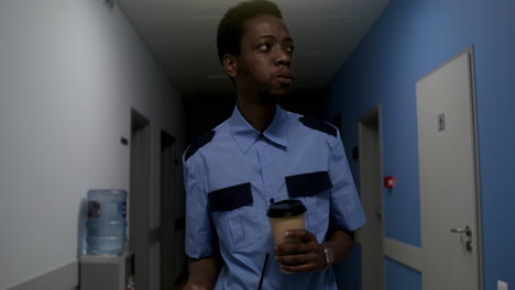 man in uniform relaxing on the corridor