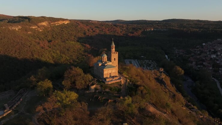 Aerial shot of medieval fortress in fading sunlight, Bulgaria