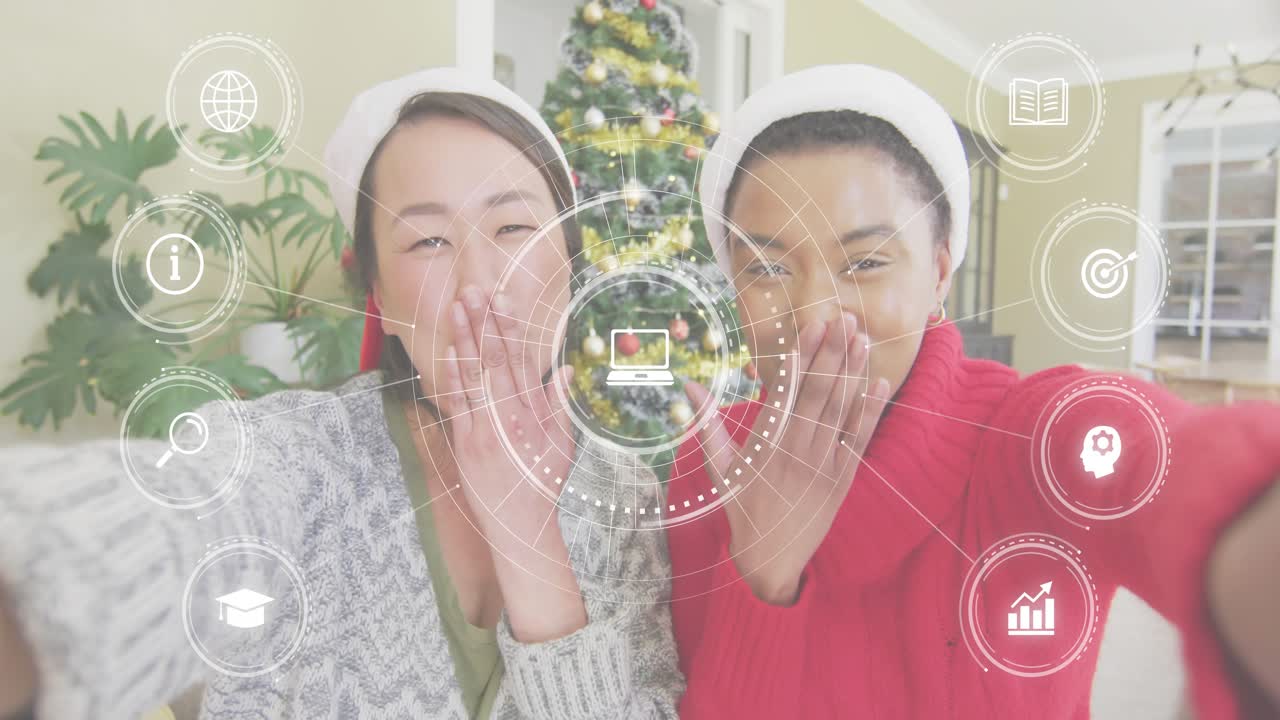 Friends framing Xmas tree selfie overlay appearing after smiling waving blowing kisses for greeting