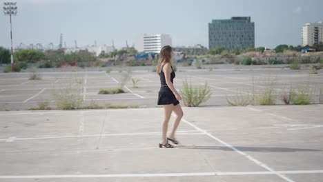 woman walking in an empty parking lot