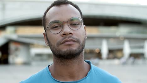 Closeup-shot-of-confident-African-American-man-looking-at-camera