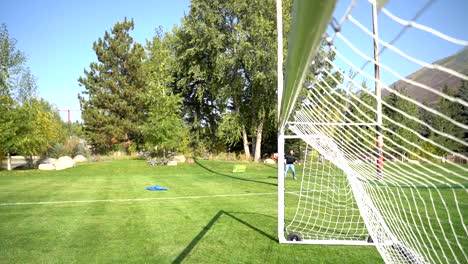 soccer ball hitting the net in slow motion