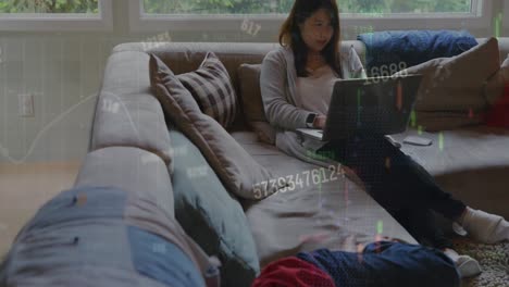 animation of graphs with changing numbers over asian mother and sons relaxing at home