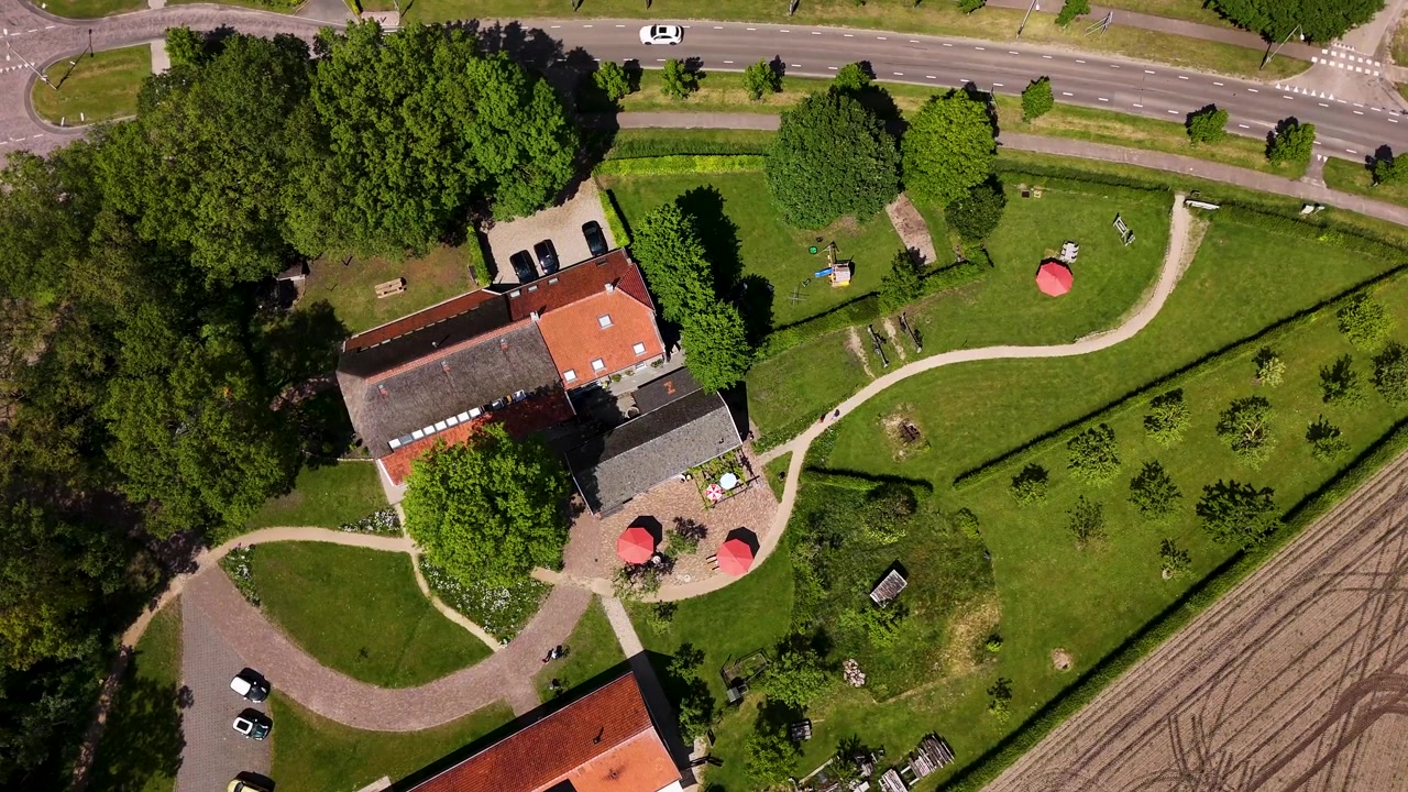 Aerial View of a Rural Farmhouse and Garden