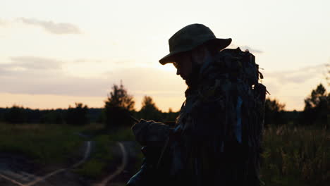 a solider aims his rifle 6