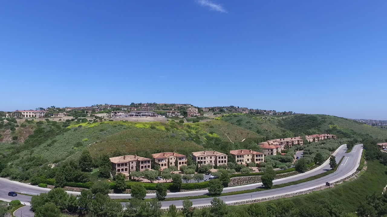 Slow motion aerial drone footage over Pelican Hill in Newport Beach, Orange County, California