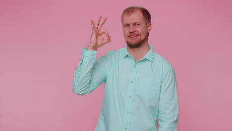 man looking approvingly, showing ok approve feedback gesture like sign positive something good