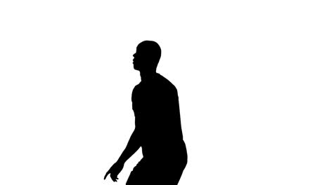 Video-of-black-silhouette-of-male-soccer-player-with-ball-isolated-on-white-background