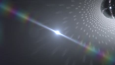 animation of shiny disco ball moving over white background