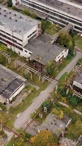 abandoned ruined factory building architecture. industrial destroyed city buildings. vertical video