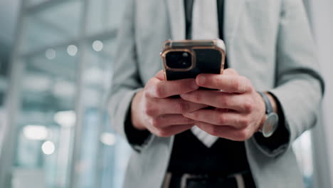 man using smartphone in modern office