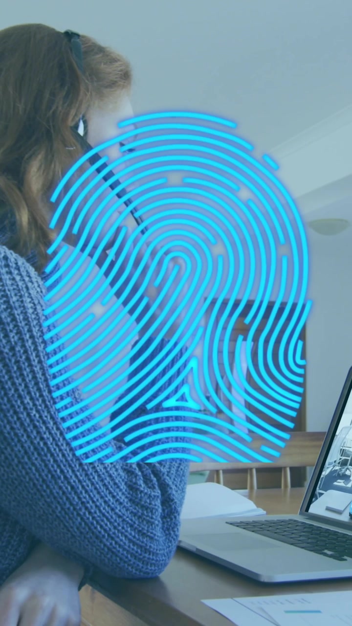 Animation of biometric fingerprint scanner over caucasian having a videocall on laptop at home