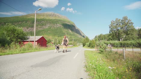 man coming back from his hike with his dog at daylight in lyngsdalen