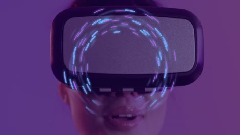 Animation-of-glowing-light-trails-of-data-transfer-over-asian-woman-using-vr-headset