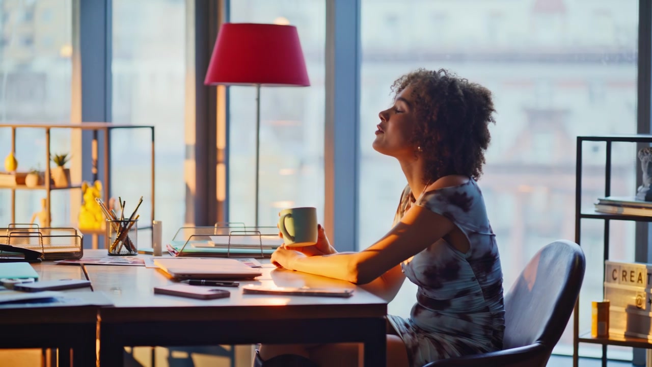 Man and woman relaxing office break laughing coffee. Coworkers morning break.
