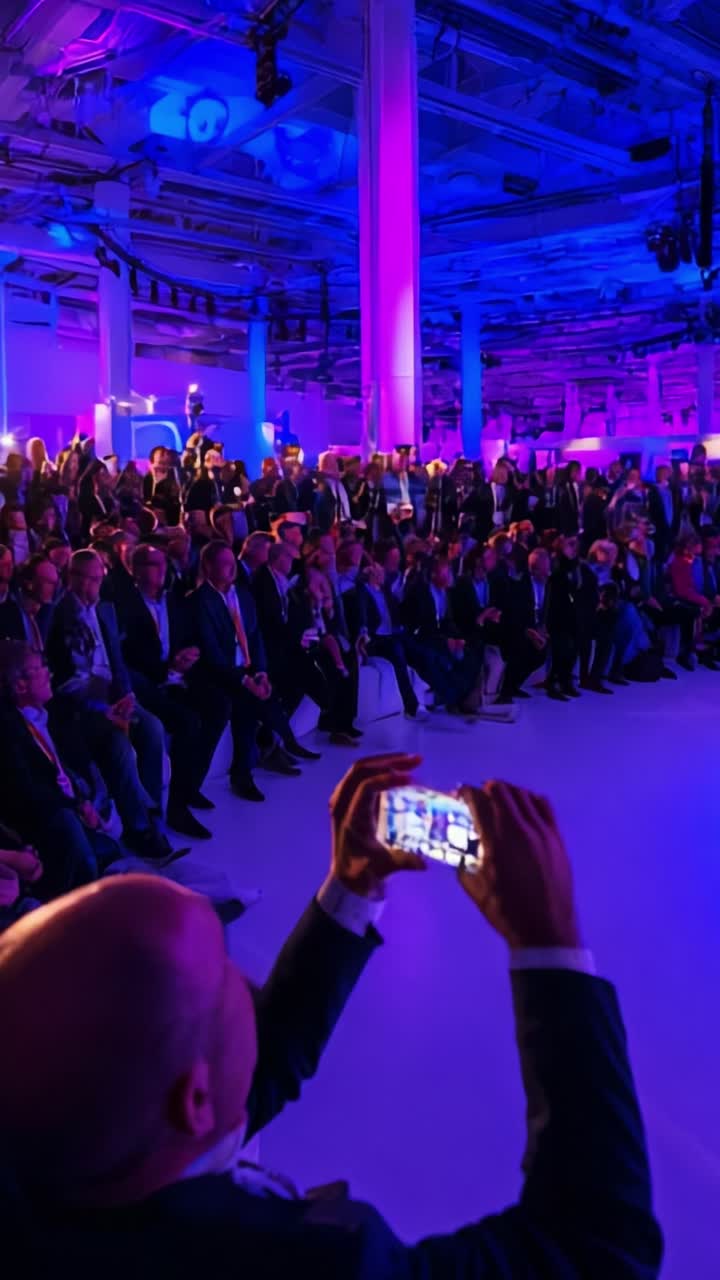 A Dynamic Conference Event Showcasing Engaged Participants Captured in an Intimate Setting with Vibrant Lighting and an Enthusiastic Audience Experience