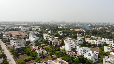 Chennai-City-ECR-Buildings-in-the-Residential-Area-Surrounded-By-Trees-Drone-4K-Shot