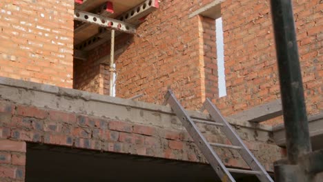 pan and tilt of new house construction with ladder and scaffolding