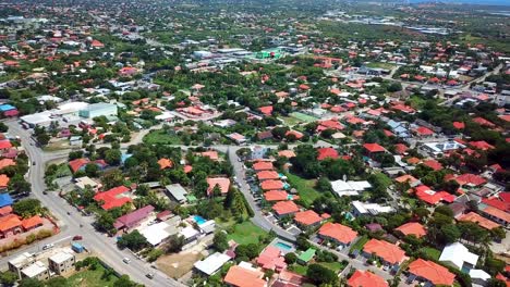 tilt down aerial view of tile-roofed houses in mahaai buurt, willemstad, curacao, dutch carribean island