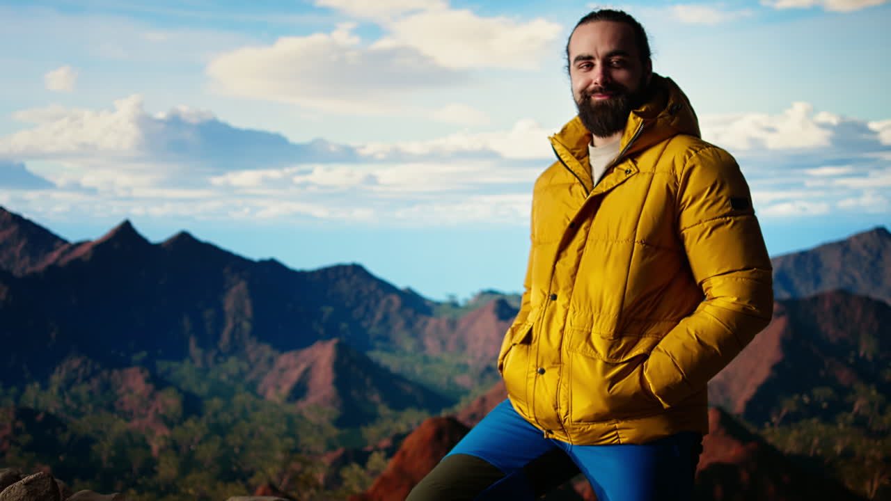 Male explorer embraces the solitude of high altitude wilderness