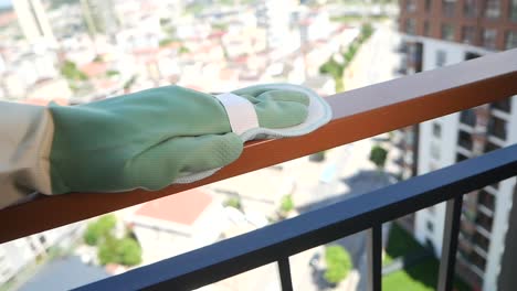 cleaning a balcony railing
