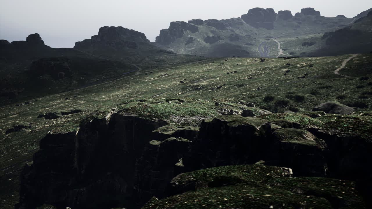 Landscape showing rocky hills and lush green terrain during overcast weather