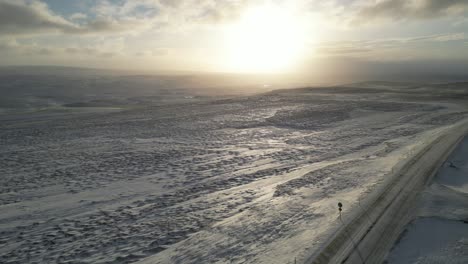 Snowy-sunrise-landscape-in-the-north-of-Iceland-during-the-winter,-aerial
