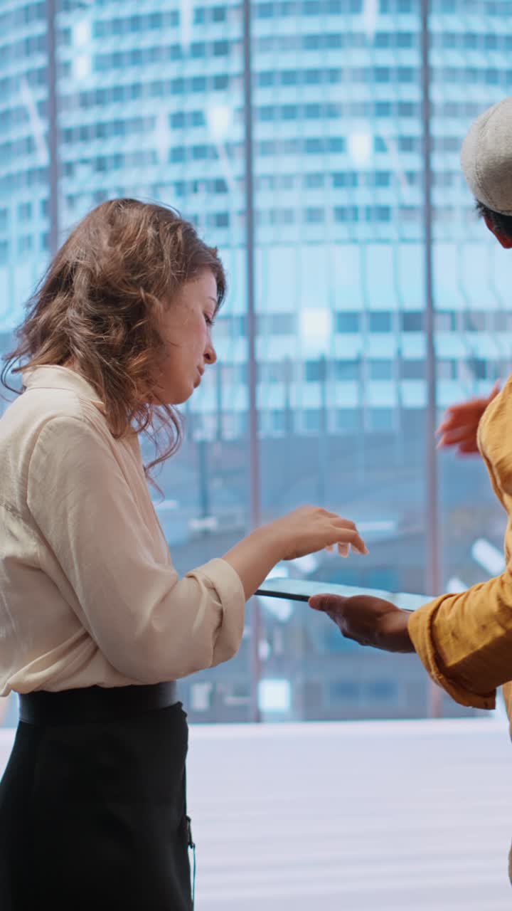 Business Colleagues Discussing Project on Tablet in Modern Office