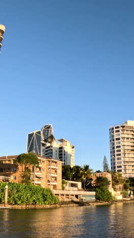 time-lapse of a riverside city skyline at sunset