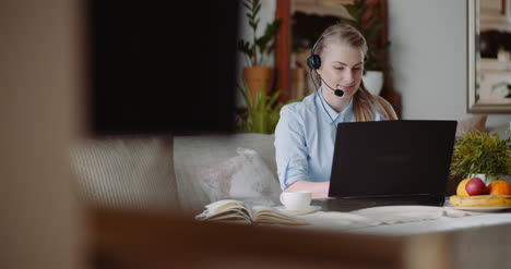 Saleswoman-Working-On-Laptop-At-Home