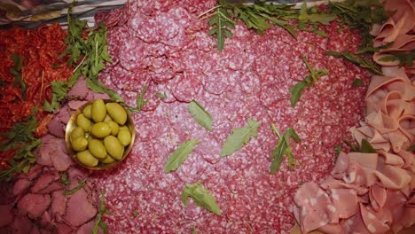 paperoni meat snacks plating on outdoor catering table